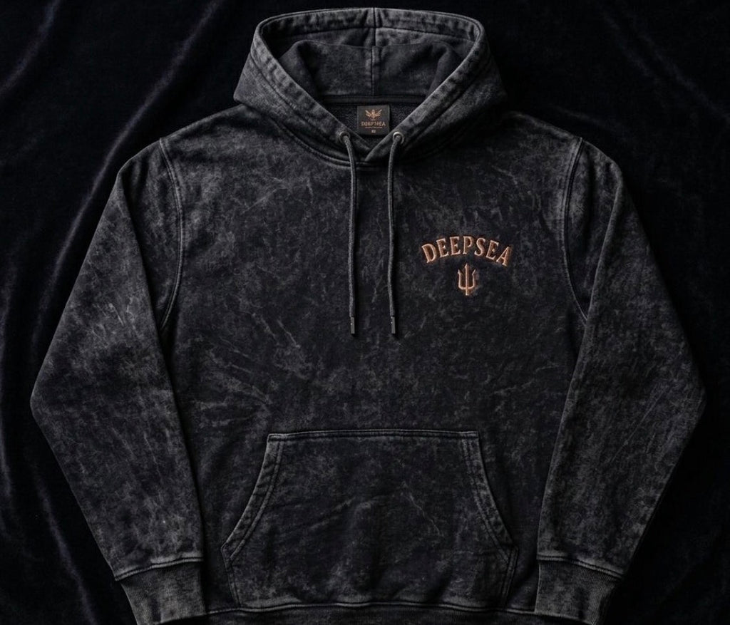 Premium acid-wash heavyweight hoodie crafted from an 80/20 cotton-poly blend (450 GSM) featuring a relaxed oversized fit, soft feel, and signature DeepSea chest logo.