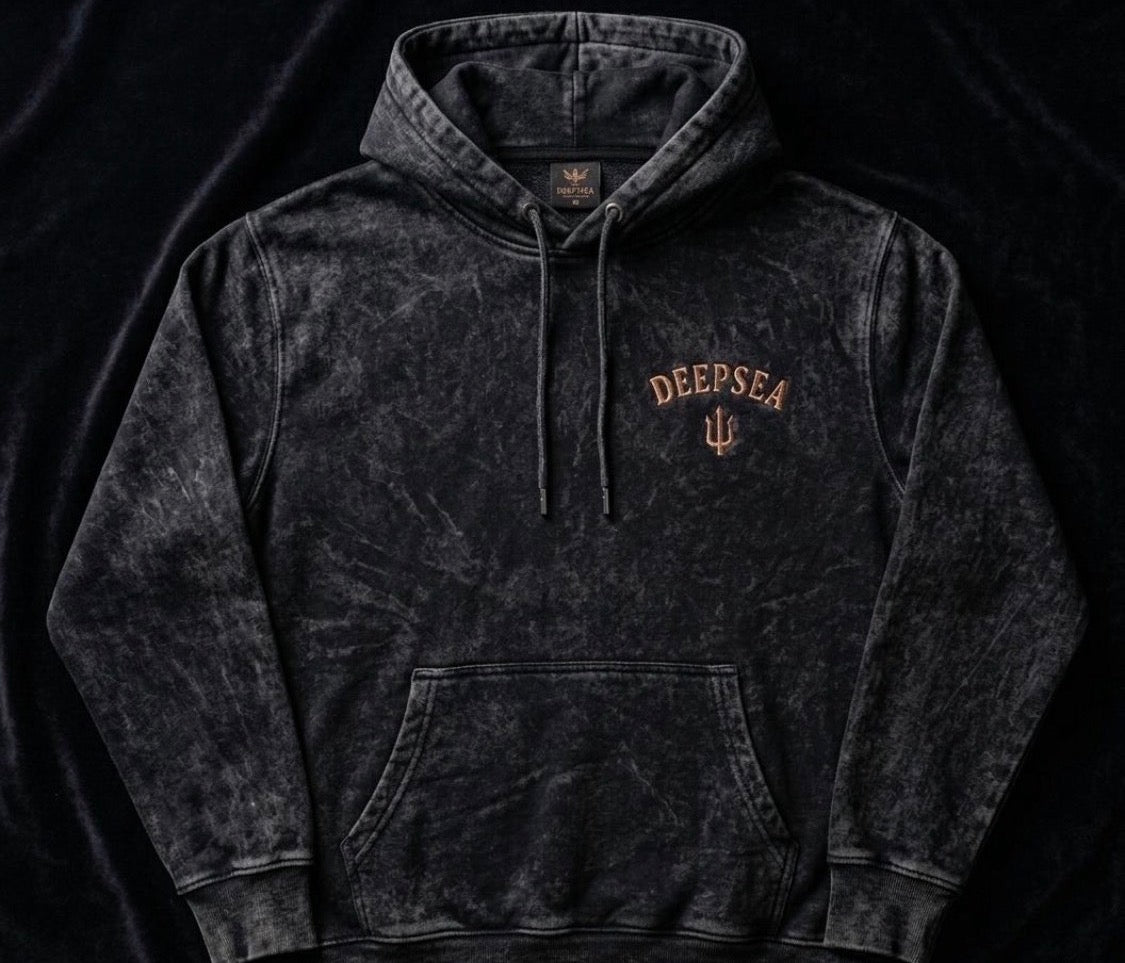 Premium acid-wash heavyweight hoodie crafted from an 80/20 cotton-poly blend (450 GSM) featuring a relaxed oversized fit, soft feel, and signature DeepSea chest logo.